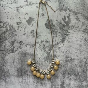 J. Crew Gold and Cream Necklace with Elegant Pendant Design